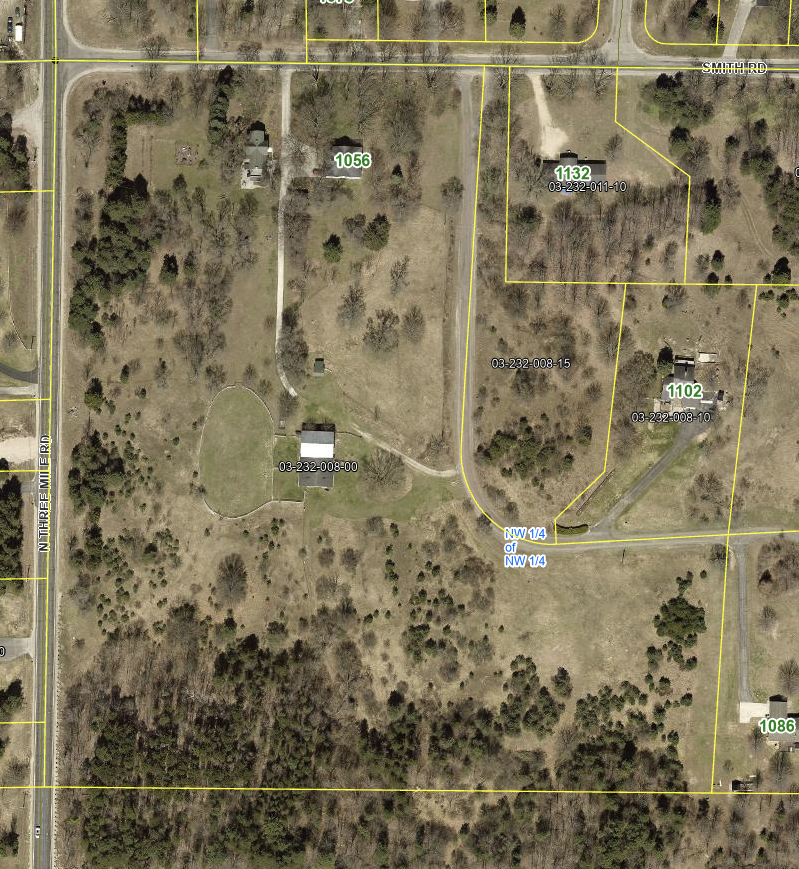 GIS aerial map of 1056 Smith Road, parcel 03-232-008-00, south of Smith Road and east of North Three Mile Road; yellow parcel overlays include neighboring land.